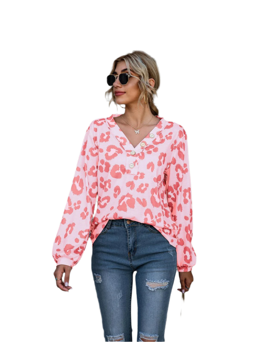 Women's long-sleeve V-neck top with a bold leopard print pattern, perfect for adding a touch of fierce fashion to your wardrobe.








