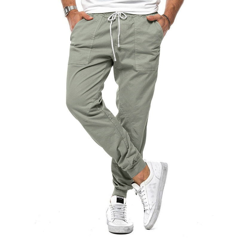 Loose tapered fit casual pants for men, perfect for spring and autumn, with multiple pockets and a stylish, comfortable design for outdoor or leisure wear.