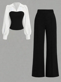 Black strapless top and black wide-leg pants with a white striped shirt on a gray background