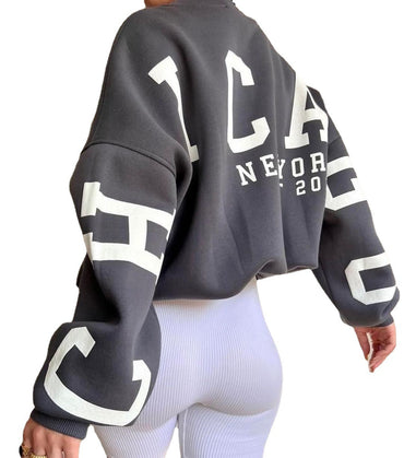 Woman wearing a printed thick long sleeve hoodie, looking cozy and stylish.

