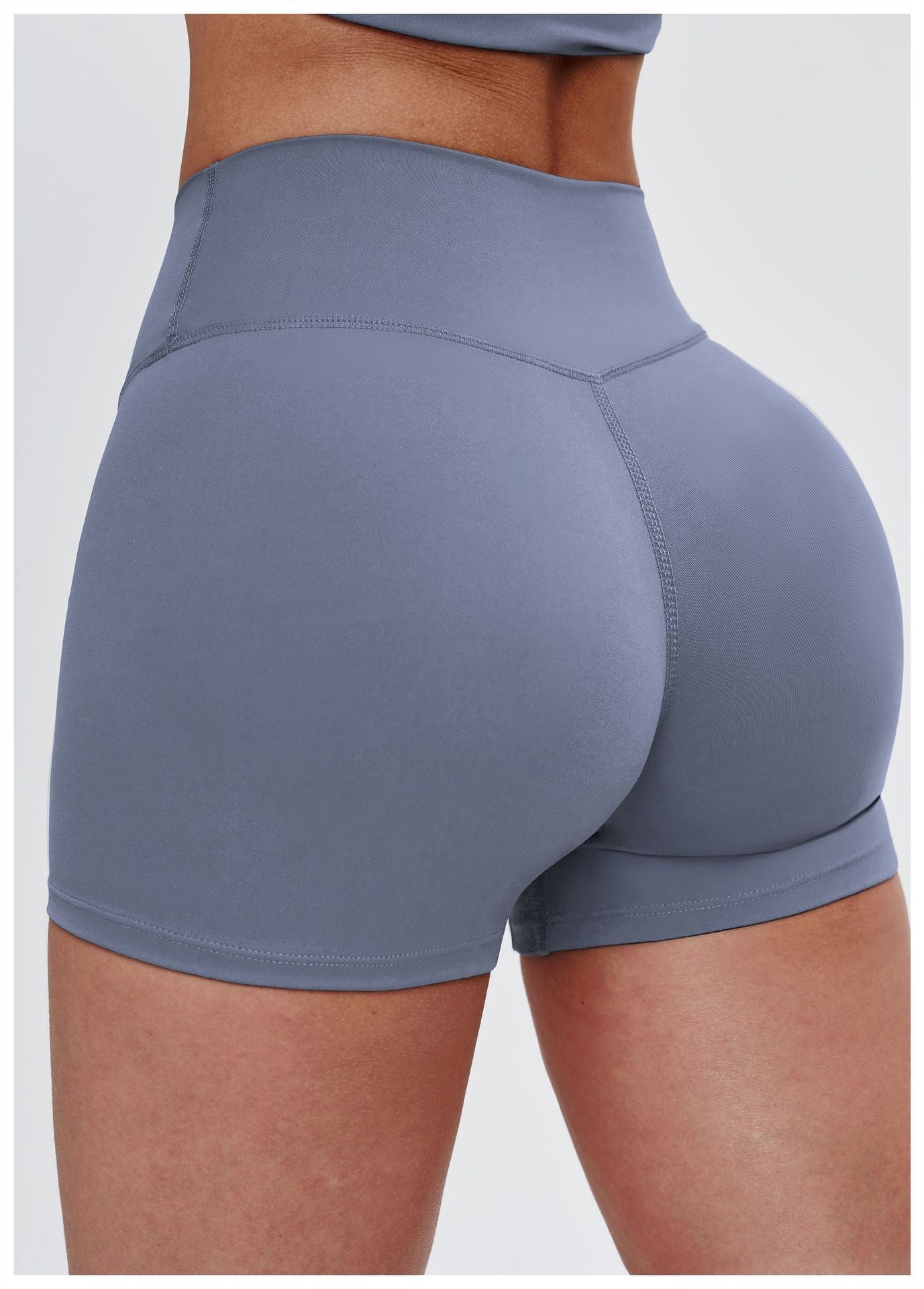 Gray athletic shorts worn by a person on a white background