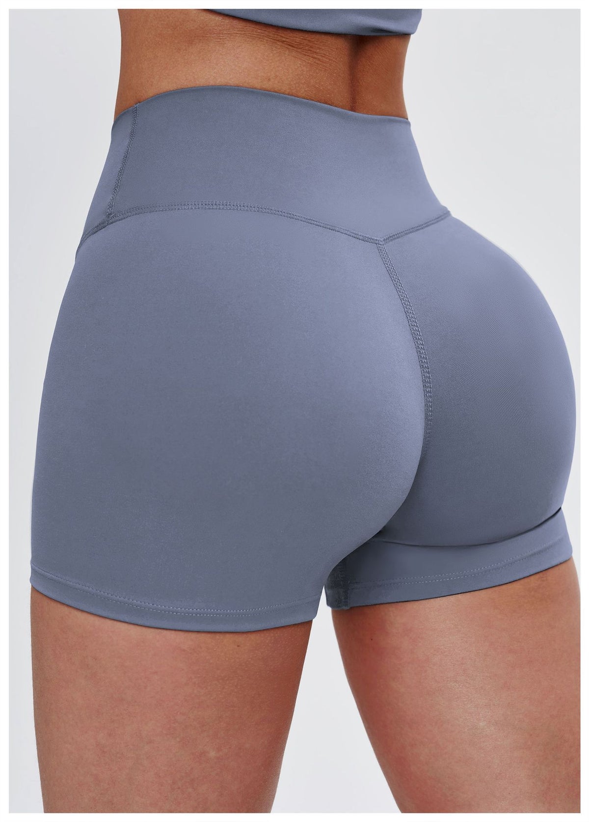 Gray athletic shorts worn by a person on a white background
