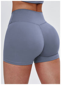 Gray athletic shorts worn by a person on a white background