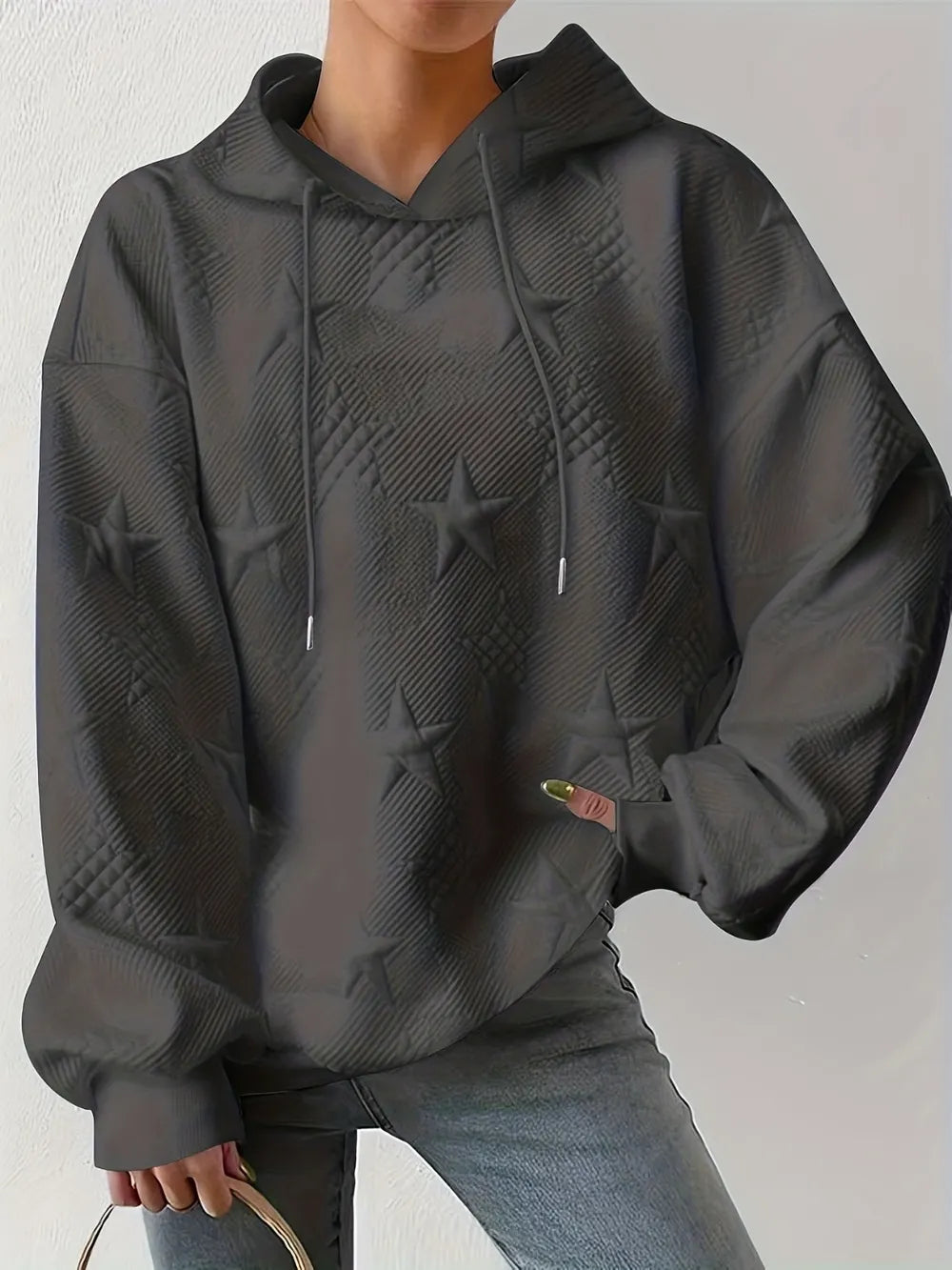 White women’s casual pullover hoodie with star texture and drawstring hood.








