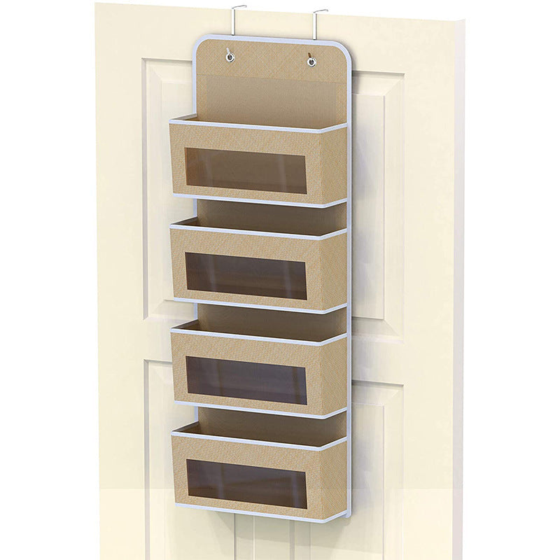 5-pocket hanging organizer on the back of a white bedroom door

