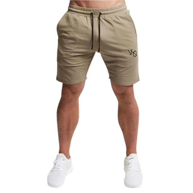 "Men's workout running shorts made from lightweight, moisture-wicking fabric for comfort and breath ability. The shorts feature an elastic waistband with an adjustable drawstring, side pockets, and a relaxed fit, perfect for running or intense workout sessions."