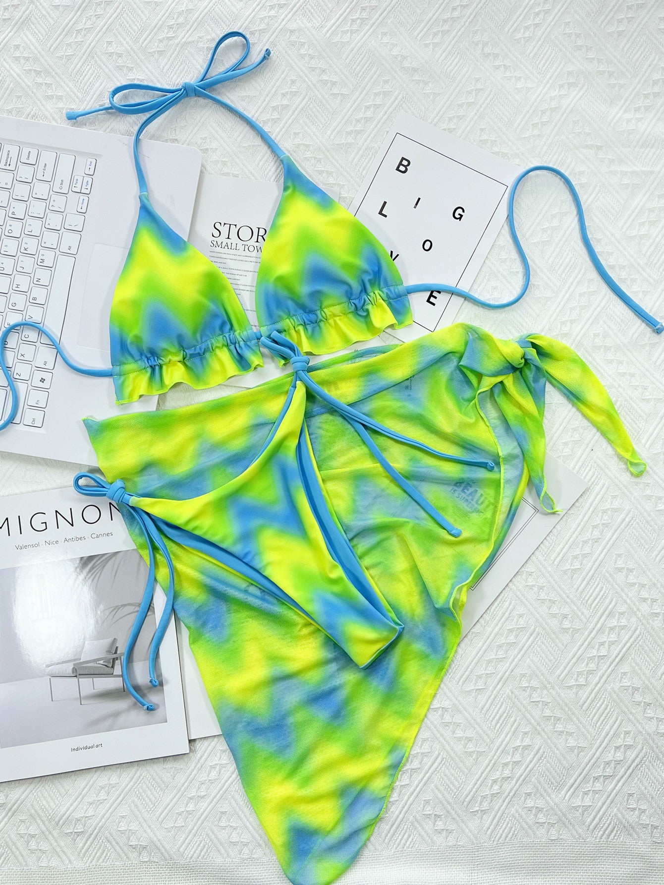 Island Crush bikini featuring a vibrant, tropical print with a flattering two-piece design. Includes adjustable straps for a custom fit and made from soft, stretchy fabric, perfect for a fun day at the beach or poolside lounging.