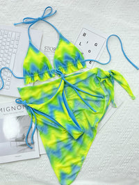 Island Crush bikini featuring a vibrant, tropical print with a flattering two-piece design. Includes adjustable straps for a custom fit and made from soft, stretchy fabric, perfect for a fun day at the beach or poolside lounging.
