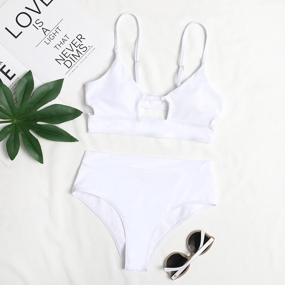 Surf Siren high-waist bikini featuring a retro-inspired design with a flattering high-waisted bottom for added comfort and support. Made from stretchy, durable fabric, perfect for beach days, poolside lounging, and stylish summer fun.