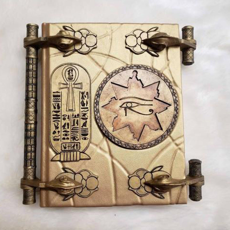 Close-up of the Book of the Dead mummy prop showing resin texture and engravings