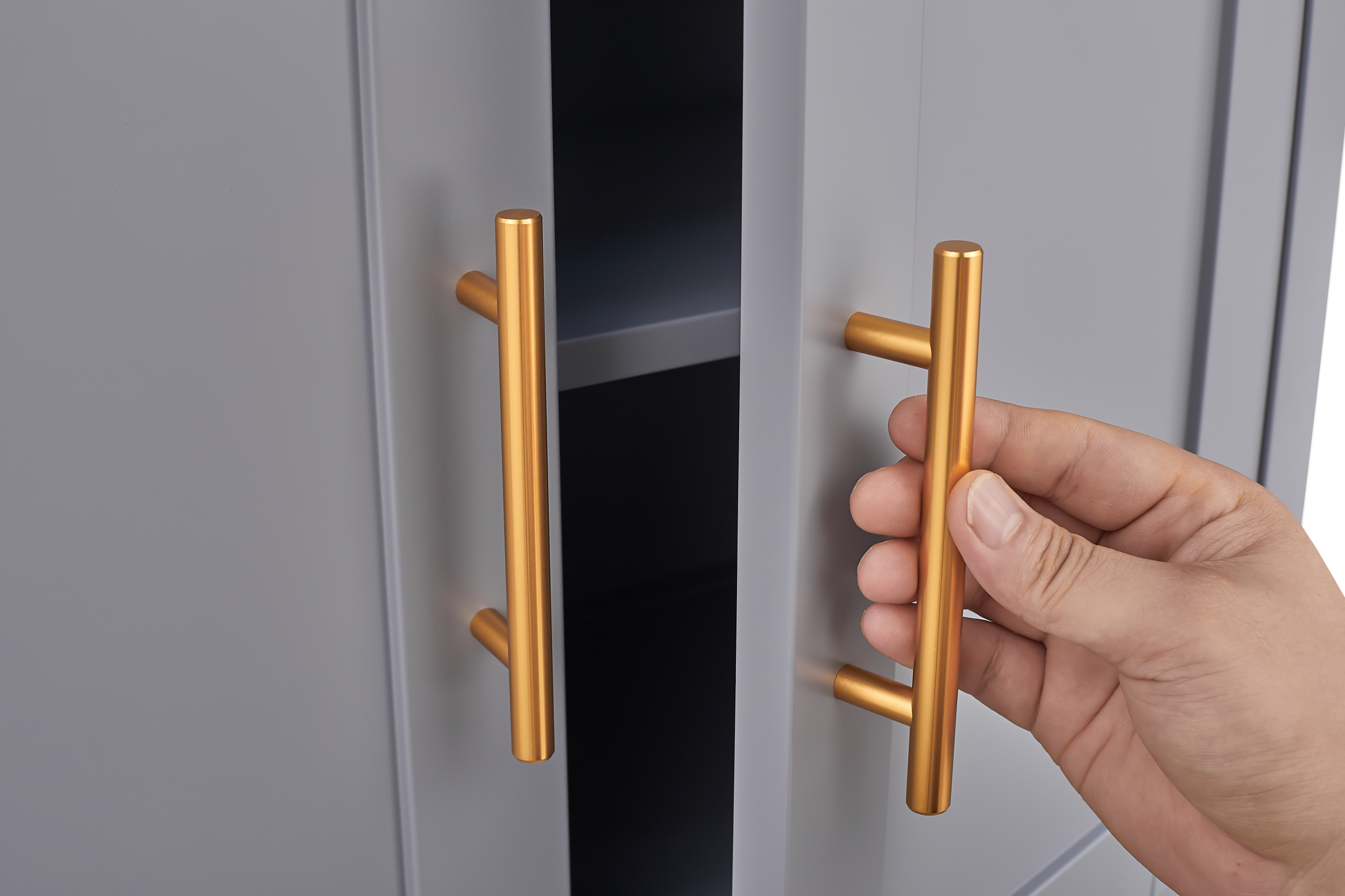 Grey metal kitchen storage cabinet with door and adjustable shelf in a modern kitchen