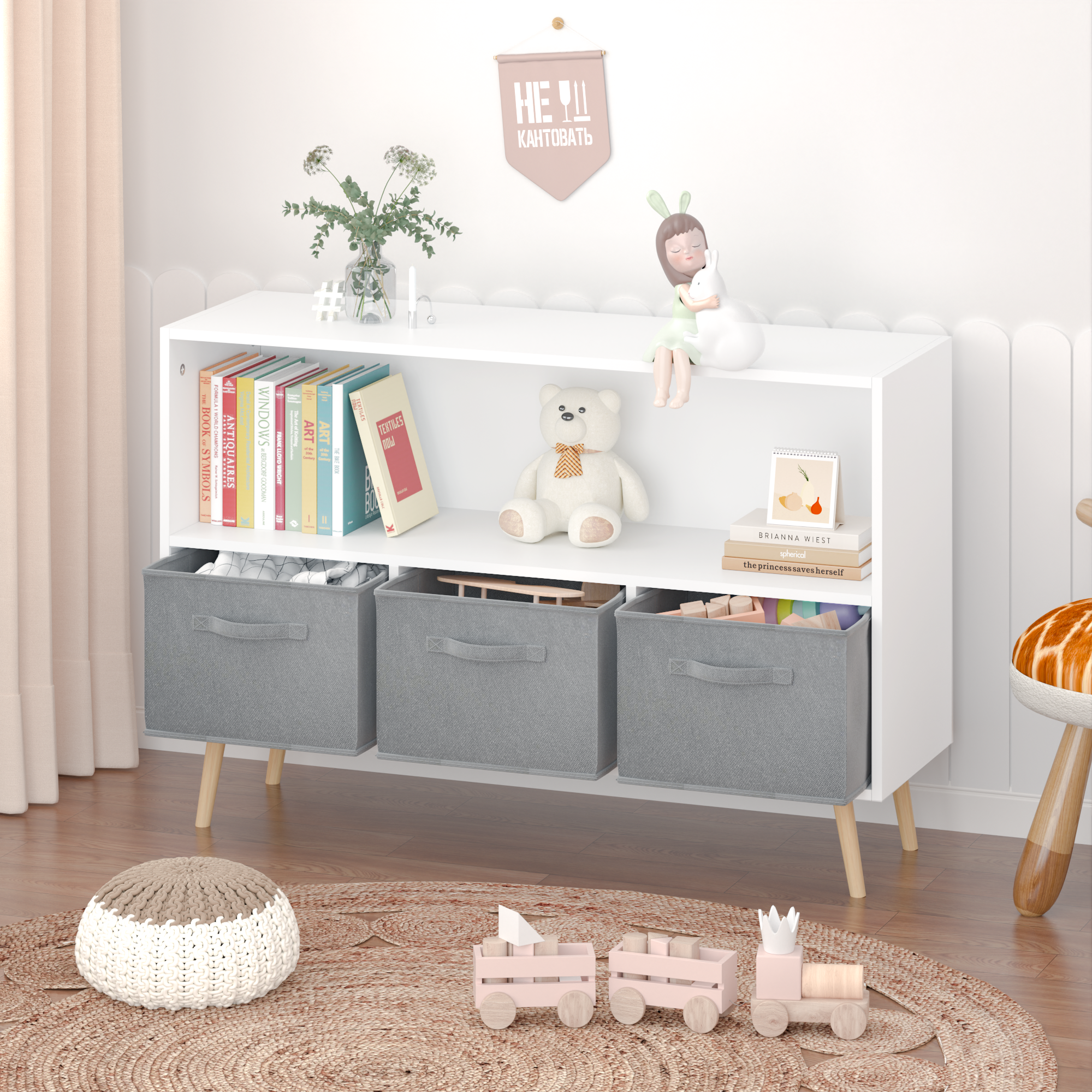 White kids bookcase with gray fabric drawers and books displayed