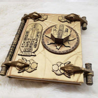Close-up of the Book of the Dead mummy prop showing resin texture and engravings