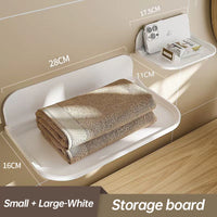 Wall-mounted plastic floating shelf in a modern bathroom holding towels