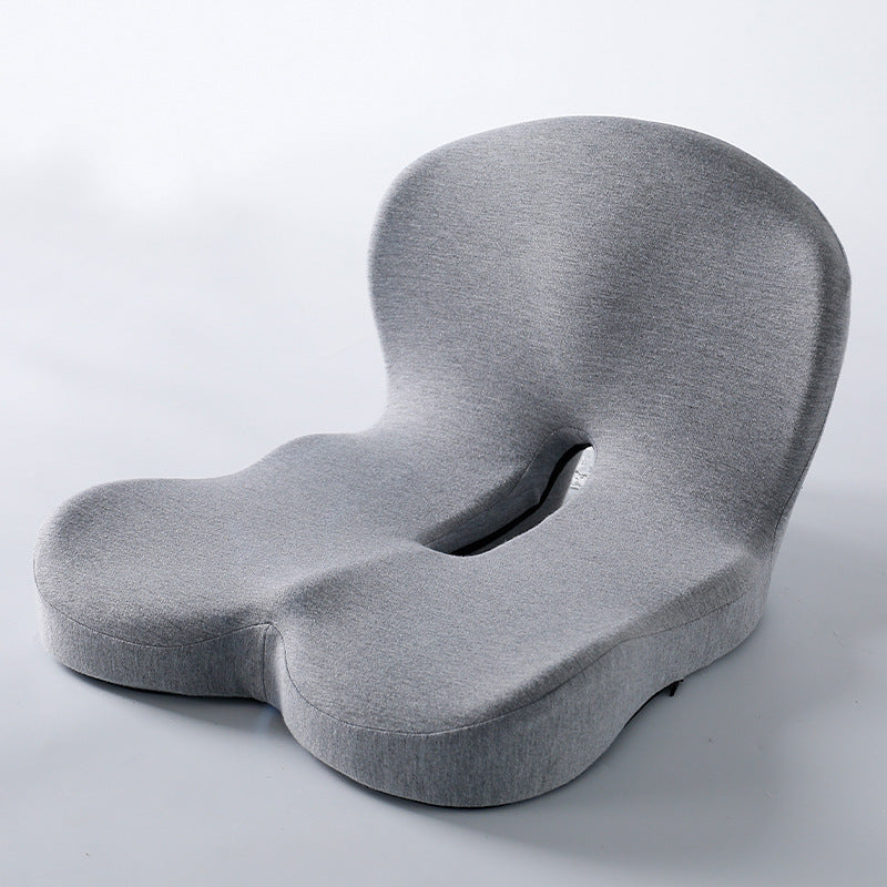 Memory foam ergonomic cushion with integrated back and seat support on an office chair

