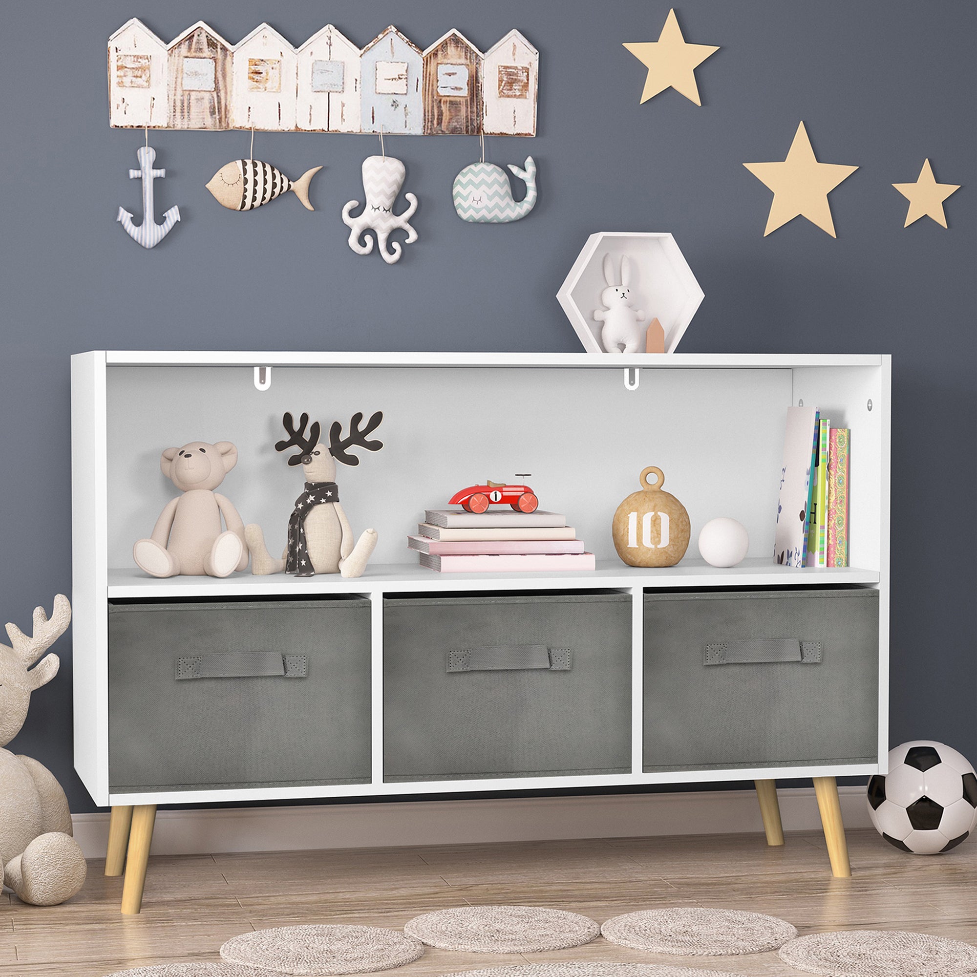 White kids bookcase with gray fabric drawers and books displayed