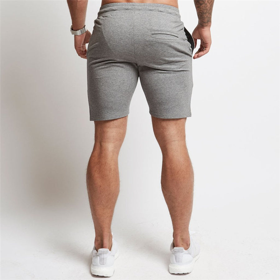 "Men's workout running shorts made from lightweight, moisture-wicking fabric for comfort and breath ability. The shorts feature an elastic waistband with an adjustable drawstring, side pockets, and a relaxed fit, perfect for running or intense workout sessions."
