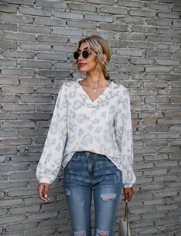 Women's long-sleeve V-neck top with a bold leopard print pattern, perfect for adding a touch of fierce fashion to your wardrobe.








