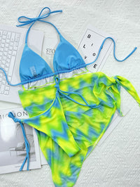 Island Crush bikini featuring a vibrant, tropical print with a flattering two-piece design. Includes adjustable straps for a custom fit and made from soft, stretchy fabric, perfect for a fun day at the beach or poolside lounging.