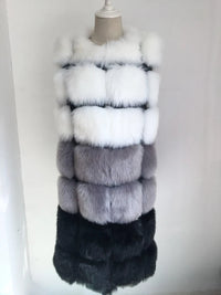Woman wearing a colorful patchwork faux fur vest in winter setting