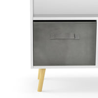 White kids bookcase with gray fabric drawers and books displayed