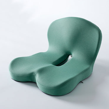 Memory foam ergonomic cushion with integrated back and seat support on an office chair

