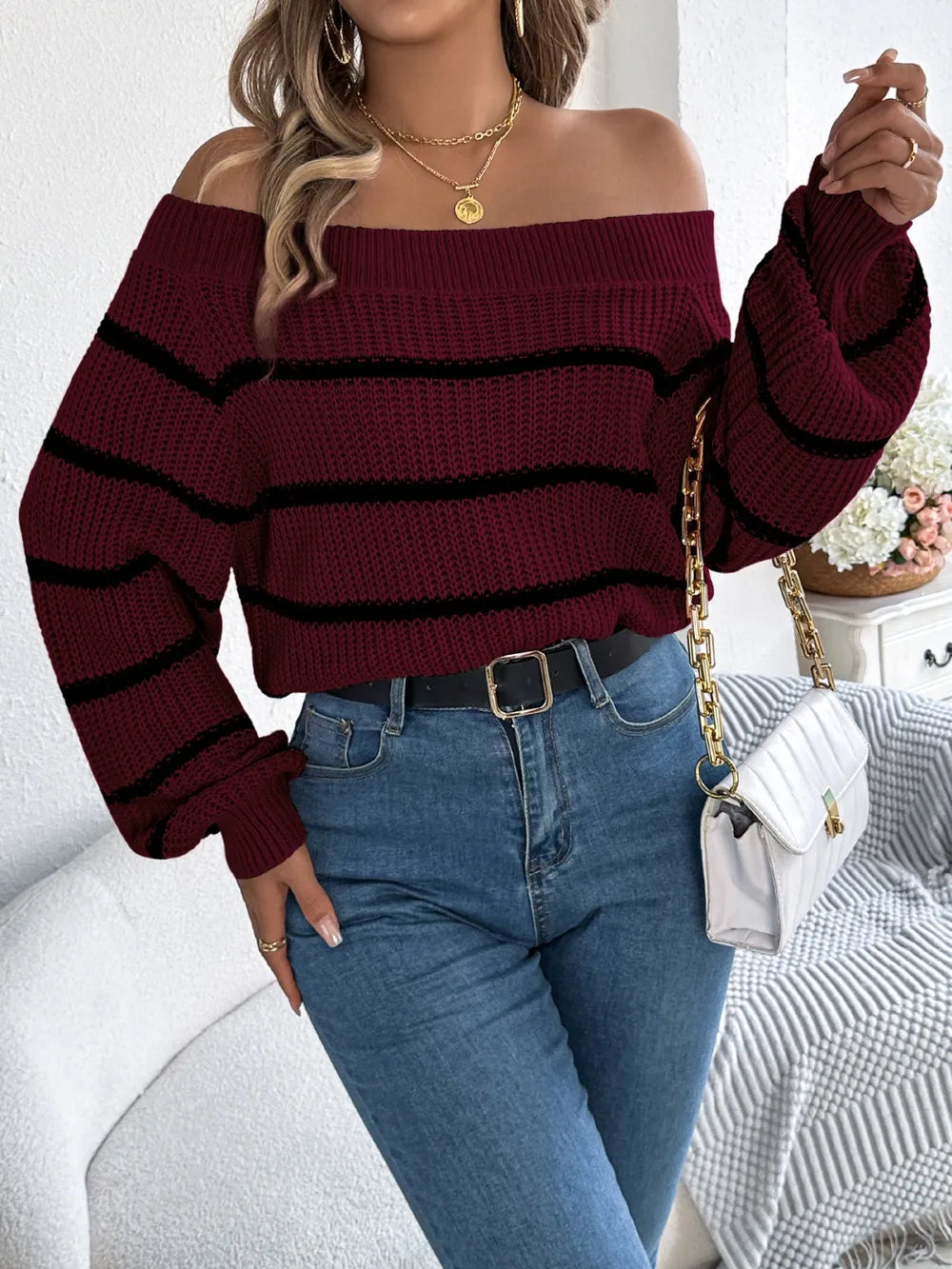 Women's striped off-shoulder sweater with long sleeves, front view

