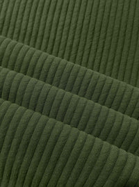Close-up of olive green ribbed fabric with a textured corduroy-like vertical stripe pattern.