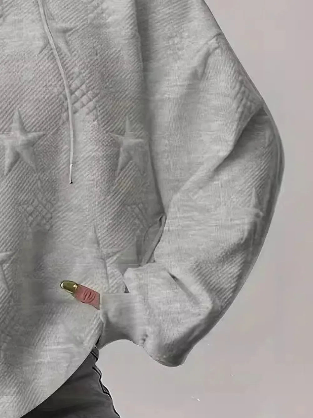 White women’s casual pullover hoodie with star texture and drawstring hood.








