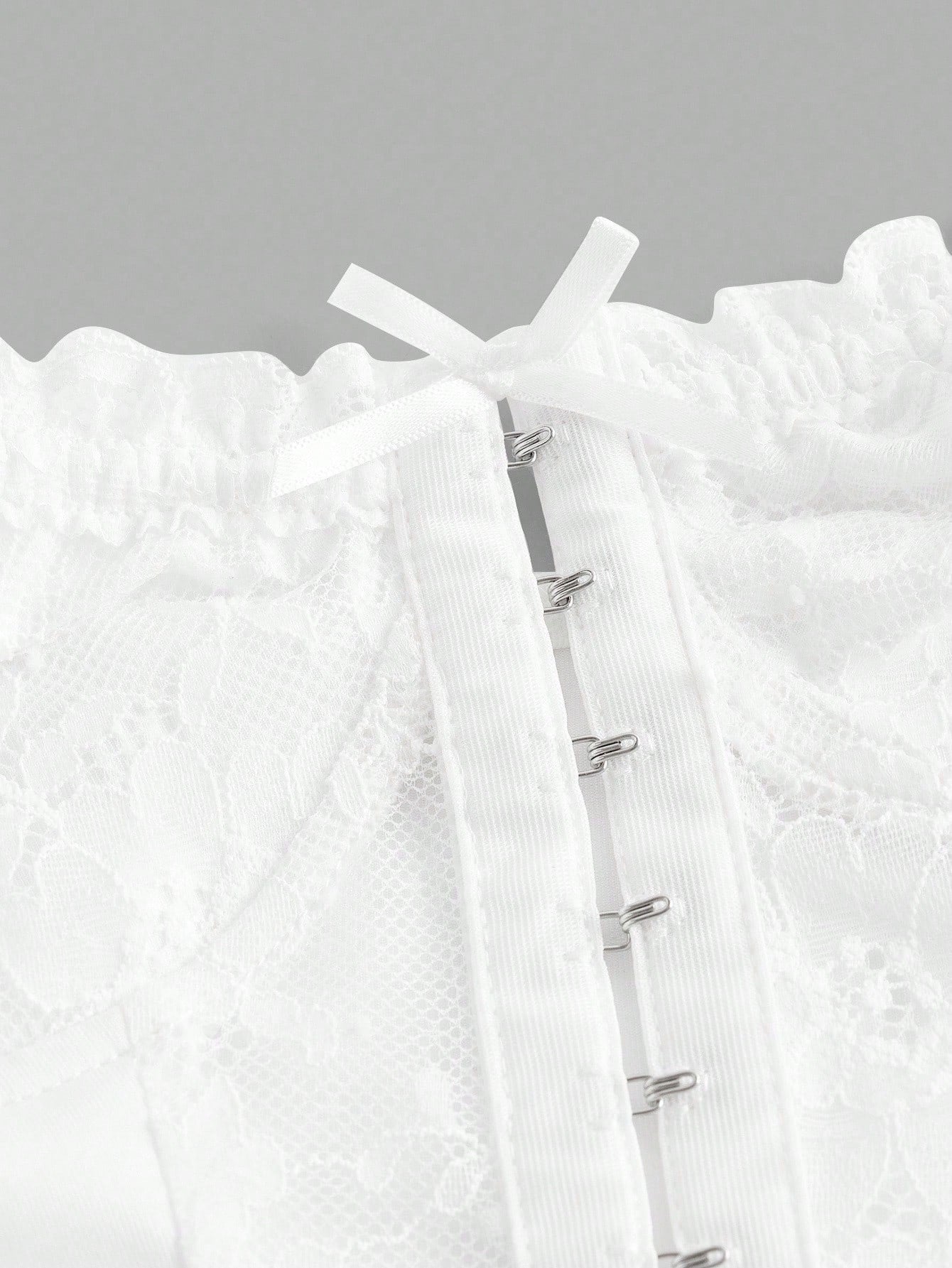 Close-up of a white textured garment with a zipper on a gray background
