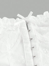 Close-up of a white textured garment with a zipper on a gray background
