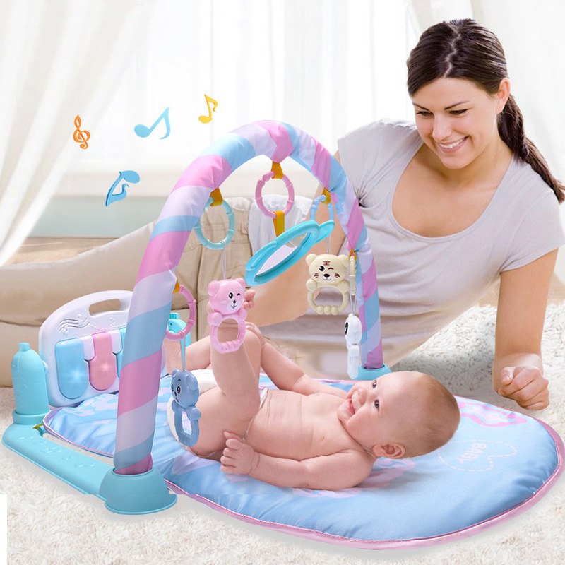 Baby playmat with keyboard, mirror, and hanging toys for newborn sensory development.

