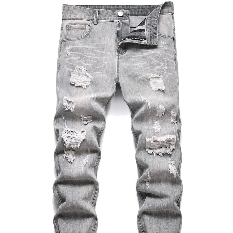 Front angle of men's motorcycle jeans with ripped detailing and slim-fit cut