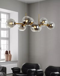 Modern Nordic minimalist glass chandelier lighting in living room setting

