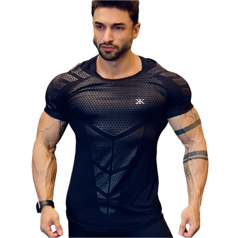 Man wearing a tight-fit short sleeve compression T-shirt in quick-dry fabric for running and sports training.

