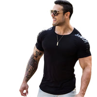 Man wearing a tight-fit short sleeve compression T-shirt in quick-dry fabric for running and sports training.

