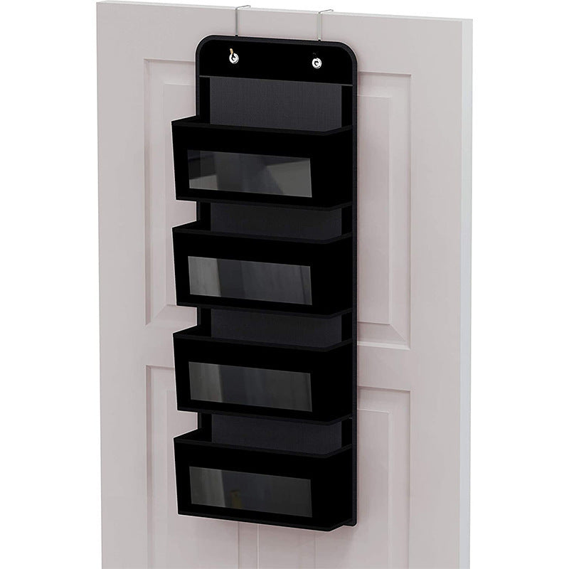 5-pocket hanging organizer on the back of a white bedroom door

