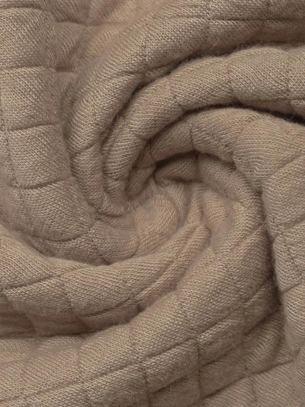 Front view of women’s plaid half zip sweatshirt with long sleeves and textured fabric

