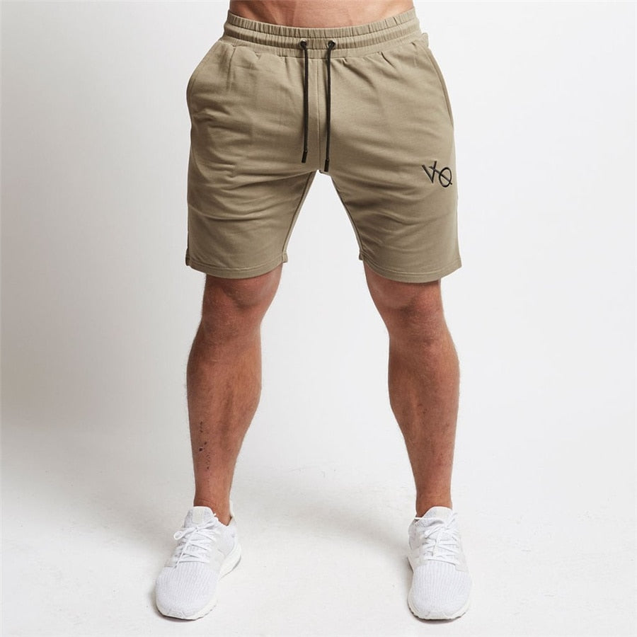 "Men's workout running shorts made from lightweight, moisture-wicking fabric for comfort and breath ability. The shorts feature an elastic waistband with an adjustable drawstring, side pockets, and a relaxed fit, perfect for running or intense workout sessions."