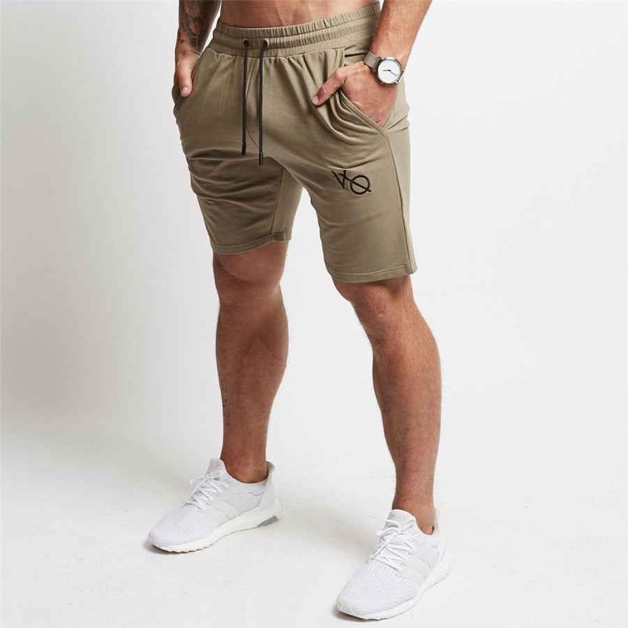 "Men's workout running shorts made from lightweight, moisture-wicking fabric for comfort and breath ability. The shorts feature an elastic waistband with an adjustable drawstring, side pockets, and a relaxed fit, perfect for running or intense workout sessions."