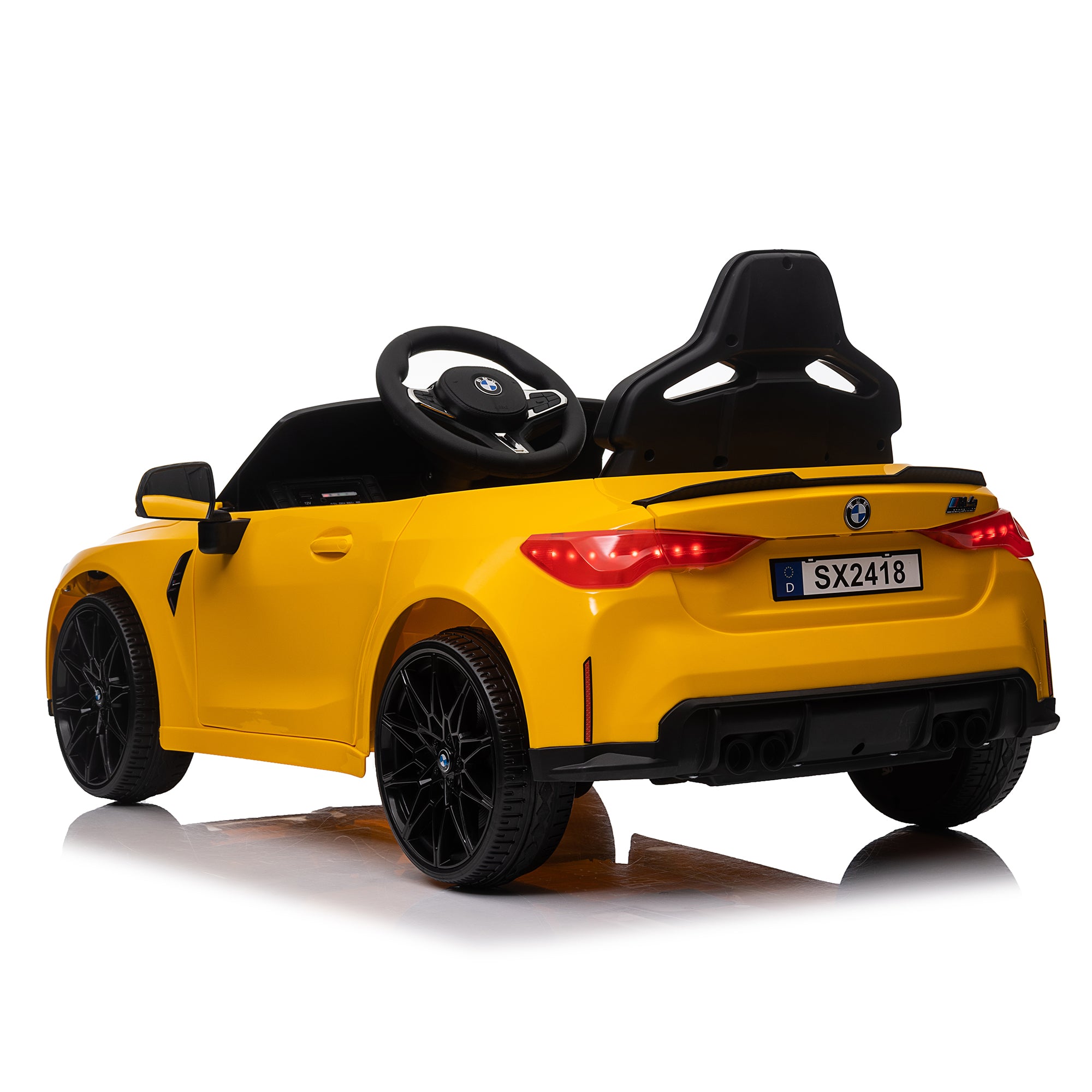 Yellow BMW M4 12V electric ride-on car for kids, featuring authentic design with working headlights, MP3 player, and forward/reverse motion. Comes with adjustable seat and steering wheel, providing a realistic driving experience for children aged 3-6