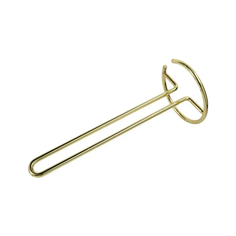 Stainless steel paper towel holder on a kitchen countertop