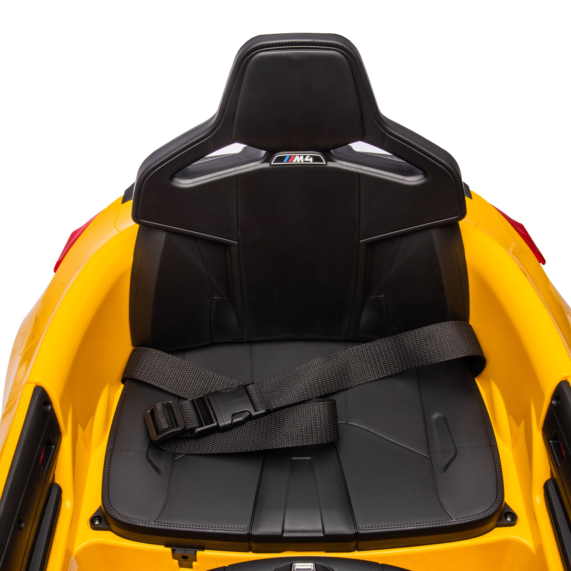 Yellow BMW M4 12V electric ride-on car for kids, featuring authentic design with working headlights, MP3 player, and forward/reverse motion. Comes with adjustable seat and steering wheel, providing a realistic driving experience for children aged 3-6