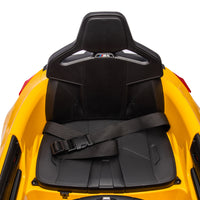 Yellow BMW M4 12V electric ride-on car for kids, featuring authentic design with working headlights, MP3 player, and forward/reverse motion. Comes with adjustable seat and steering wheel, providing a realistic driving experience for children aged 3-6