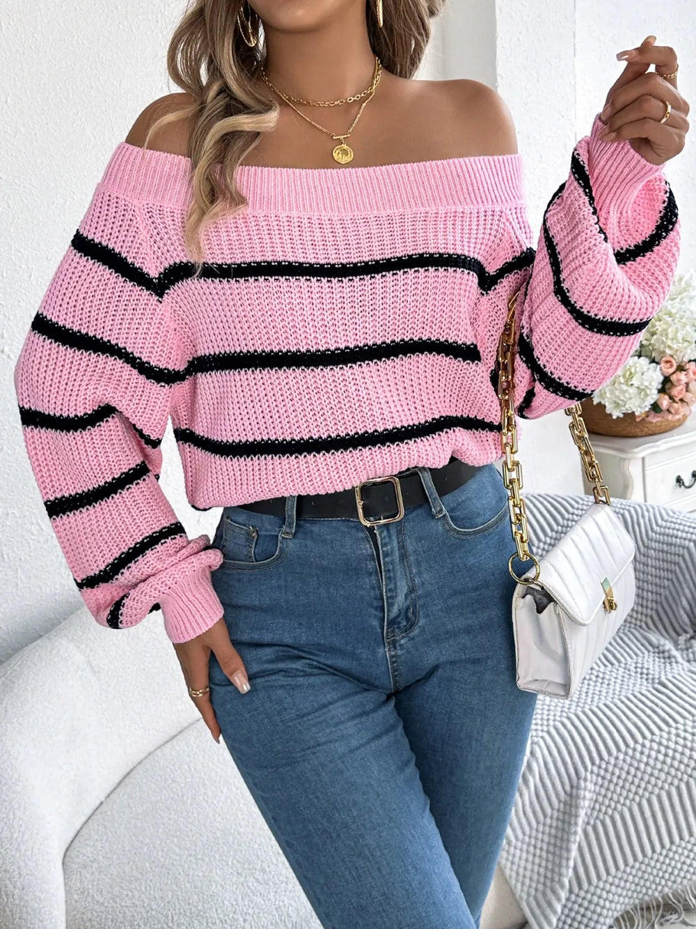 Women's striped off-shoulder sweater with long sleeves, front view

