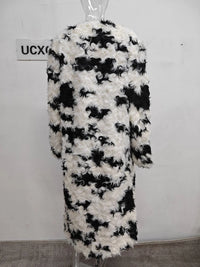 Model wearing the Temperament O-neck lambswool fur coat with contrast color design

