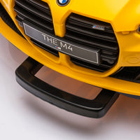Yellow BMW M4 12V electric ride-on car for kids, featuring authentic design with working headlights, MP3 player, and forward/reverse motion. Comes with adjustable seat and steering wheel, providing a realistic driving experience for children aged 3-6