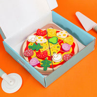 Children's wooden play kitchen set with pizza, fruits, and vegetables

