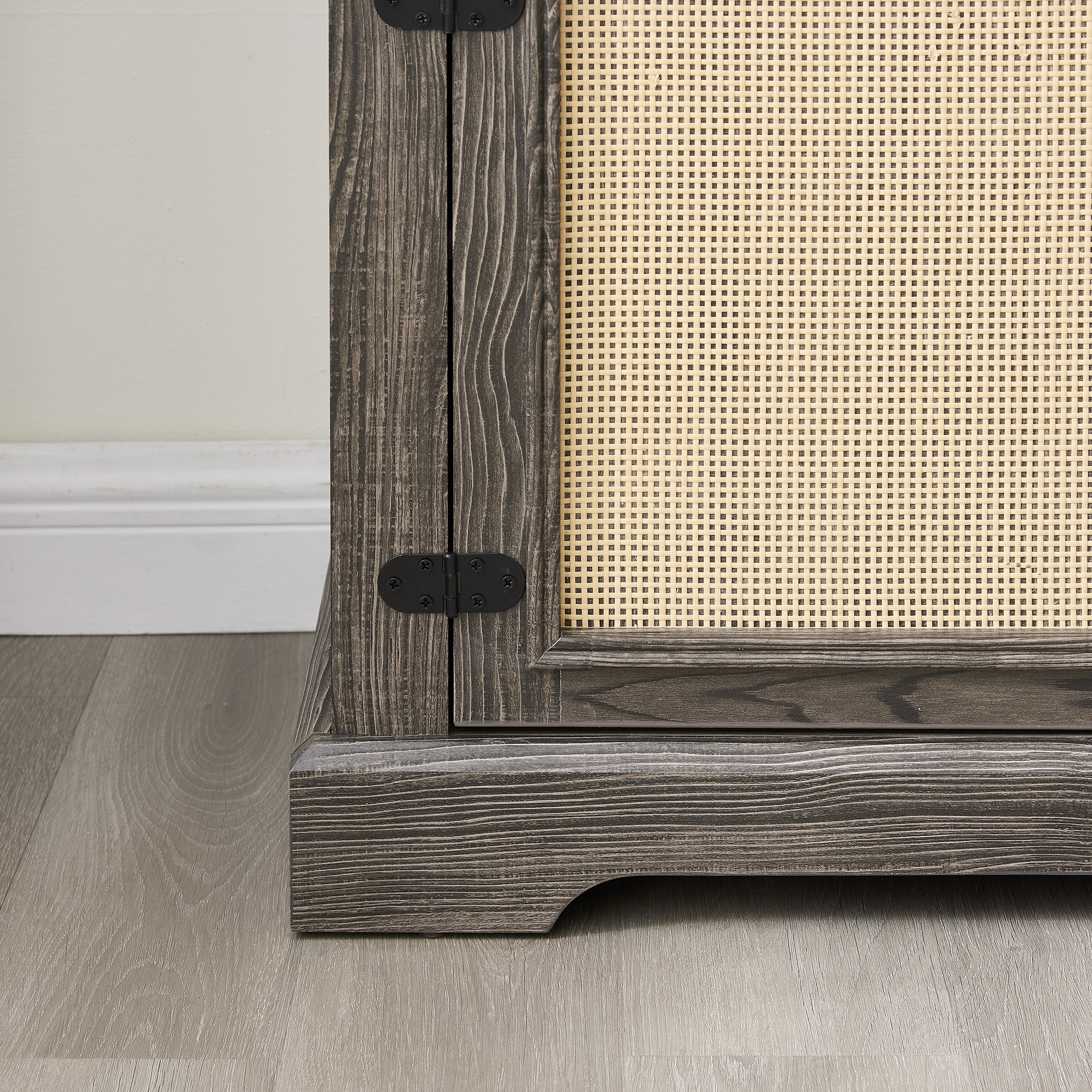 Gray TV stand with rattan doors and shelves for storage