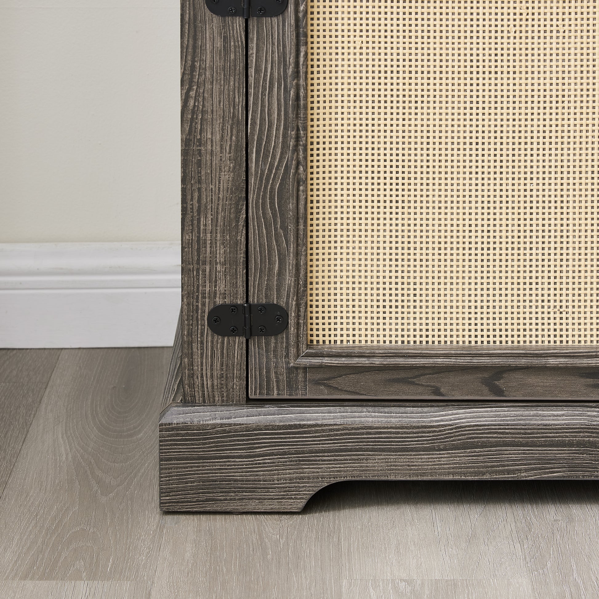 Gray TV stand with rattan doors and shelves for storage